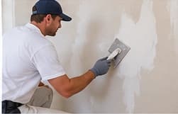 Plaster wall repair and surface preparation before painting